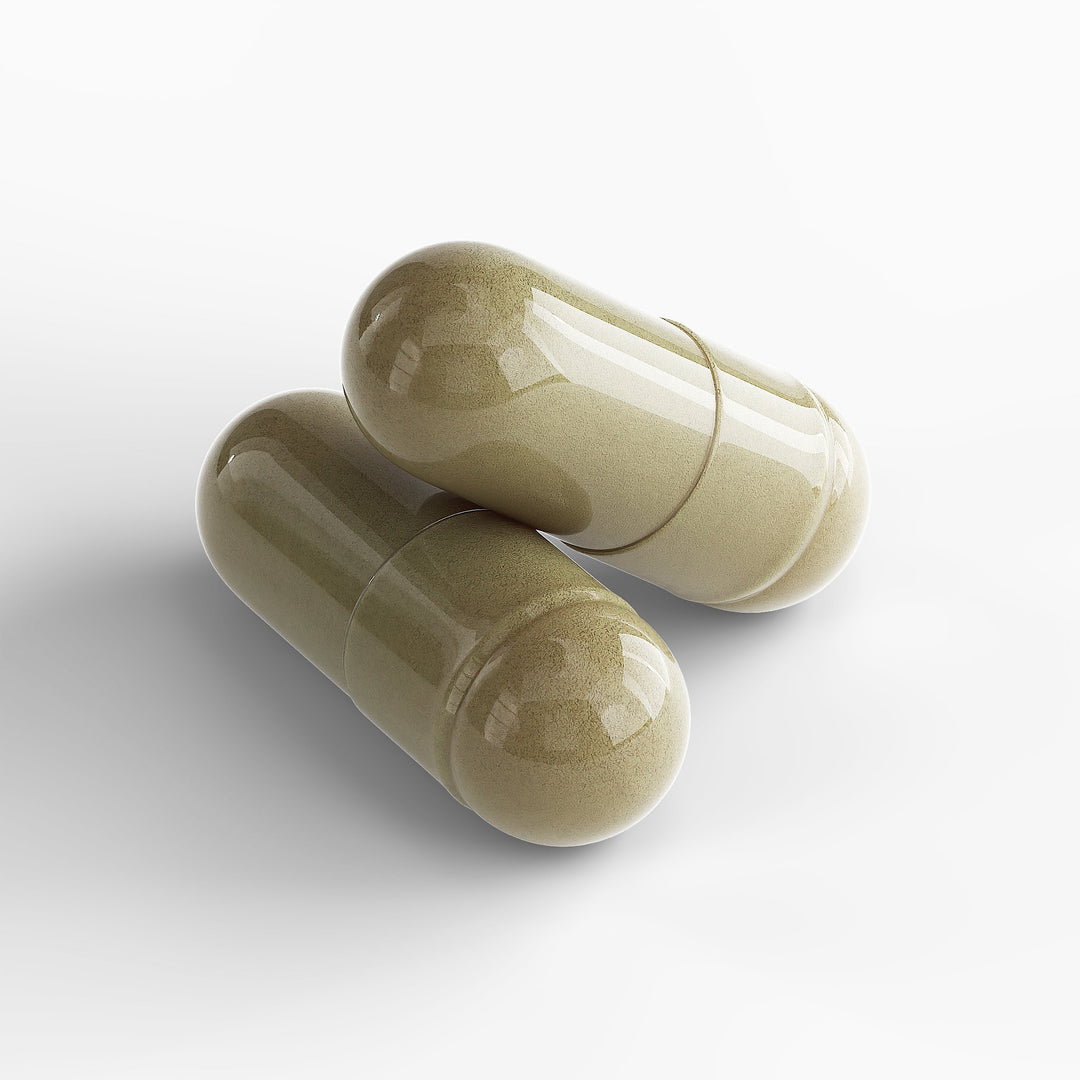 Two beige capsules on a white background