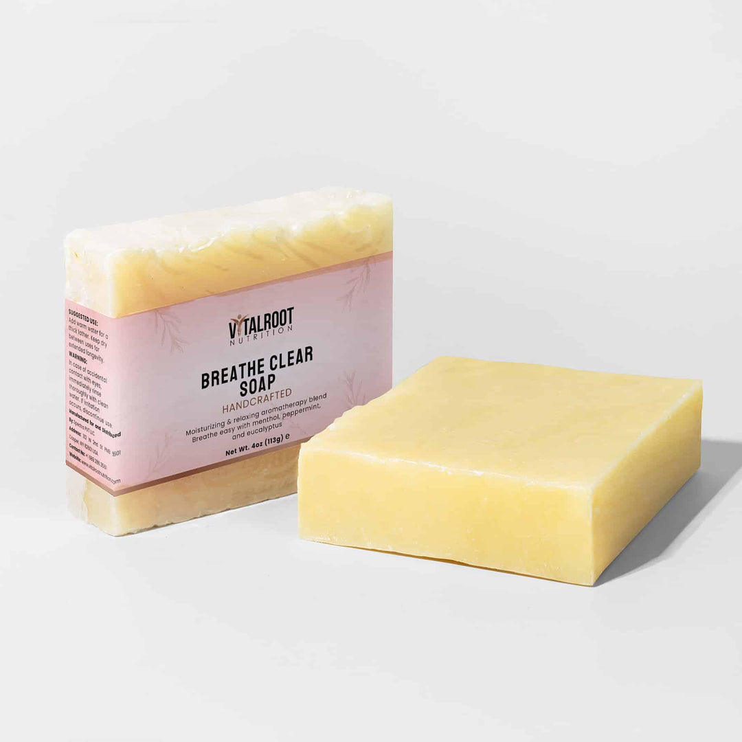 Bar of Breathe Clear Soap next to its packaging on a light gray background