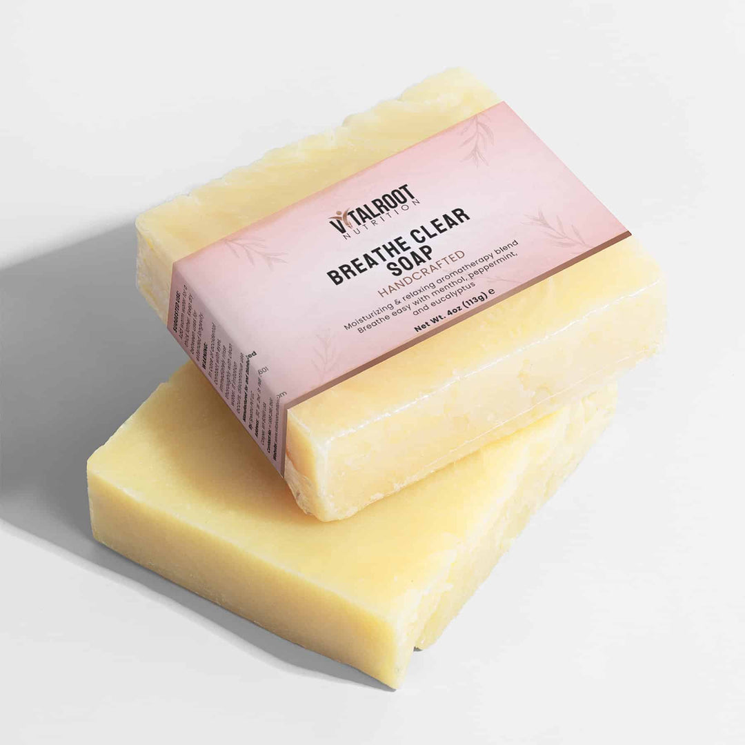Two bars of soap with a pink label on a light background