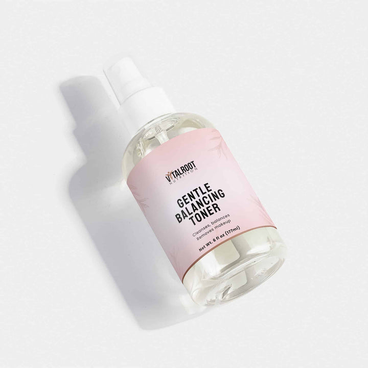 Bottle of 'Vitalbody' gentle balancing toner on a light gray background