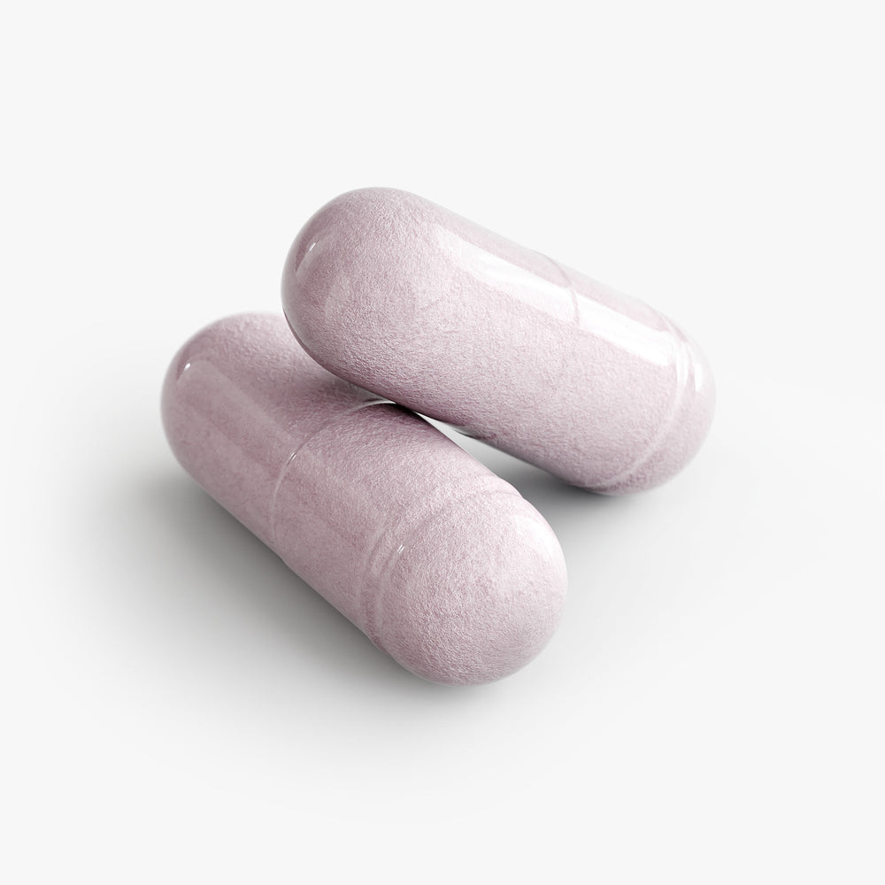 Two pink cylindrical objects on a white background