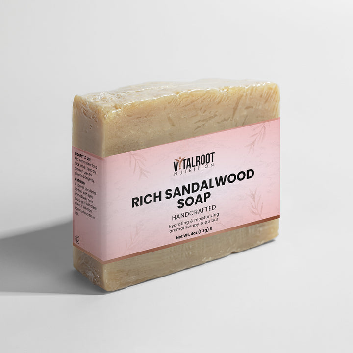 Bar of soap with a pink label on a white background