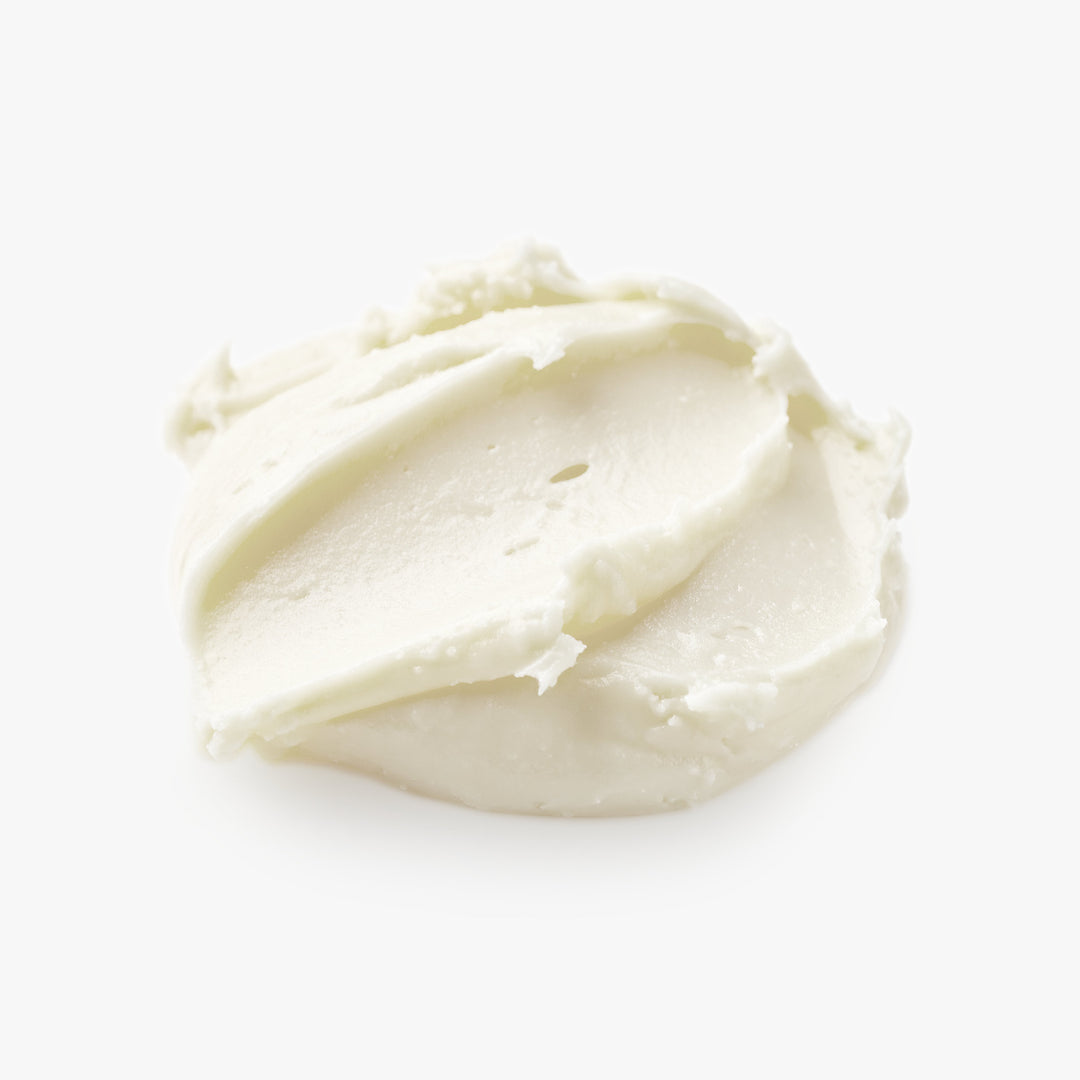 White cream or frosting on a white background