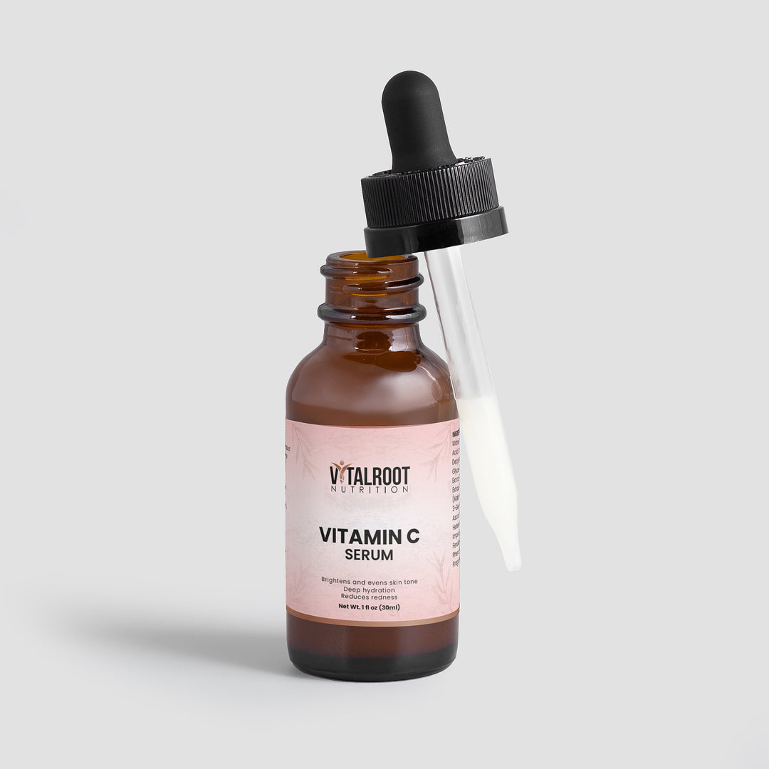 Vitamin C serum bottle with dropper on a light gray background