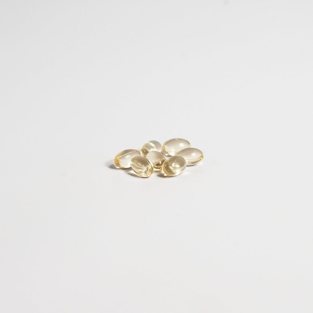 Gold oval-shaped objects on a light gray background
