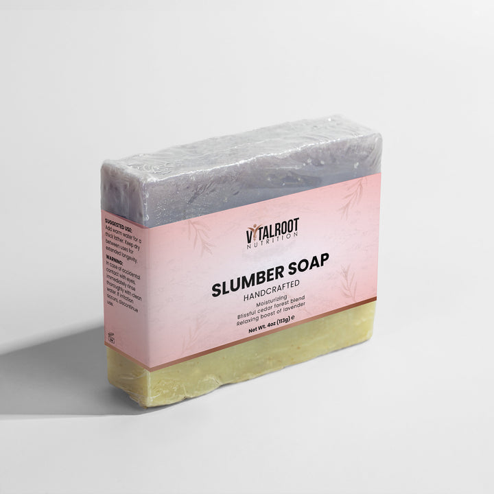Bar of slumber soap with a pink label on a white background