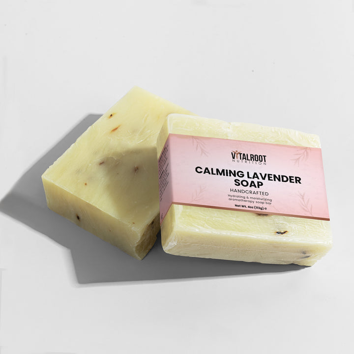 Two bars of soap with a pink label on a light gray background