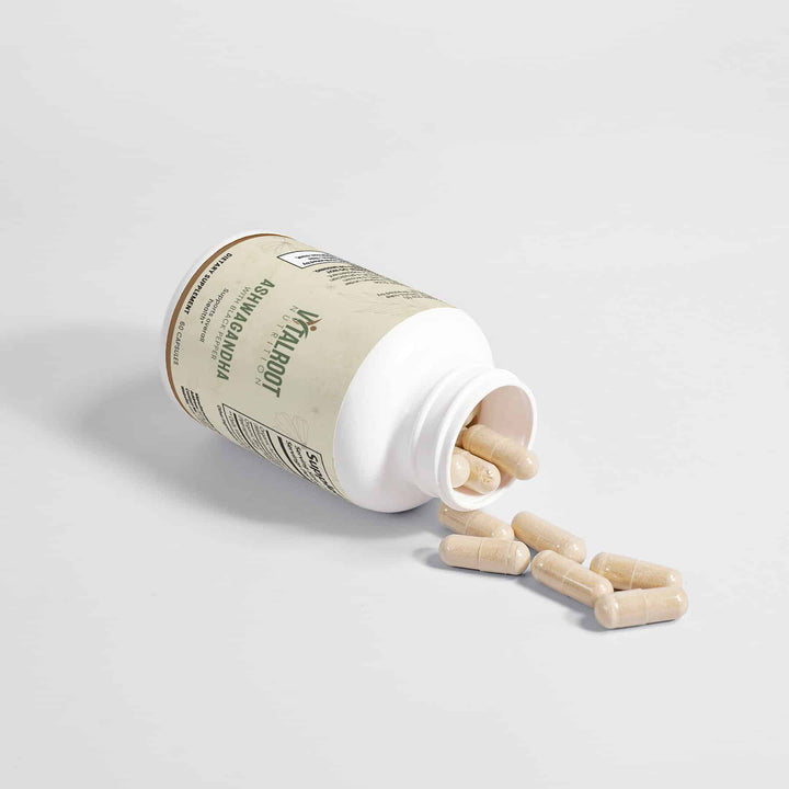 Supplement bottle with wooden capsules spilling out on a light gray background