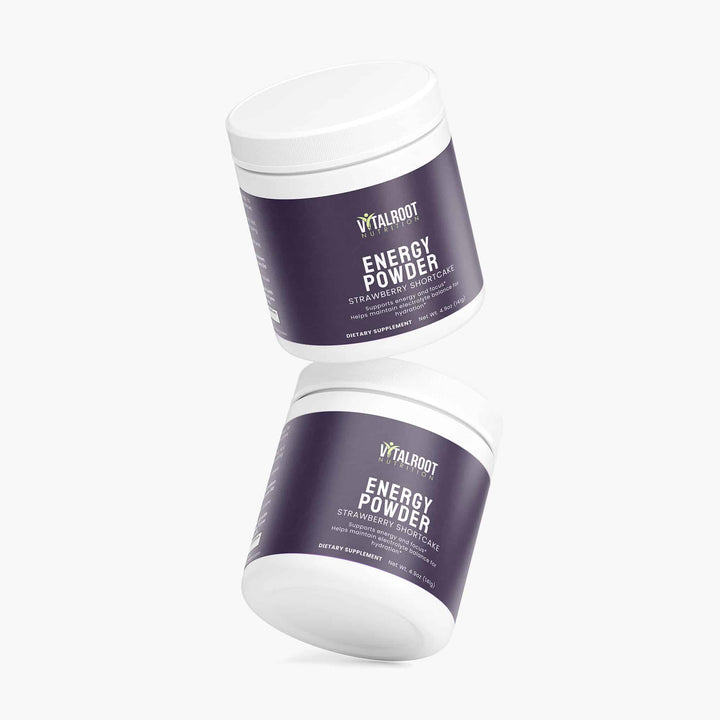 Two containers of Vitalout Energy Powder on a white background