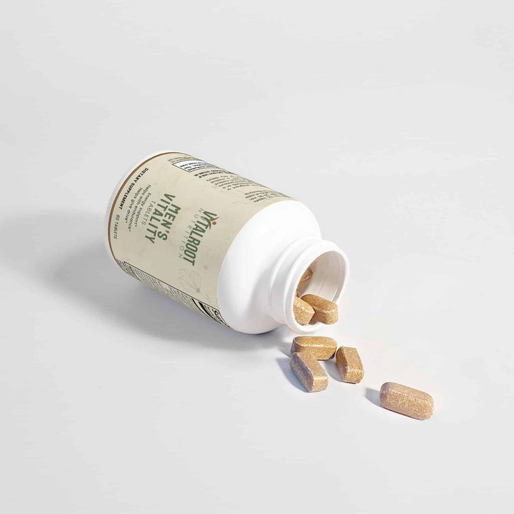 Open supplement bottle with wooden capsules spilling out on a light gray background