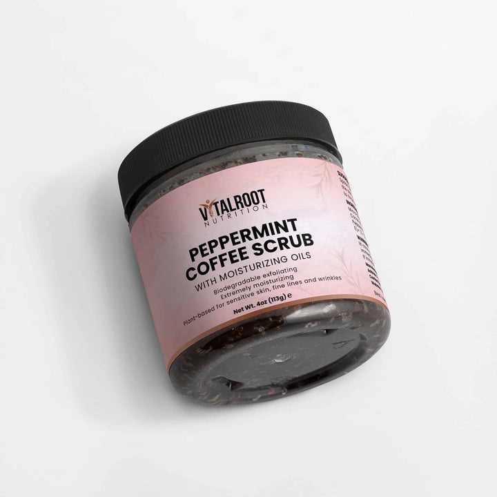 Jar of peppermint coffee scrub with pink label on a white background