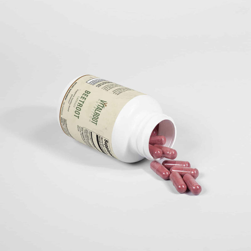 Beetroot Capsules bottle with capsules spilled out next to it, showcasing product.