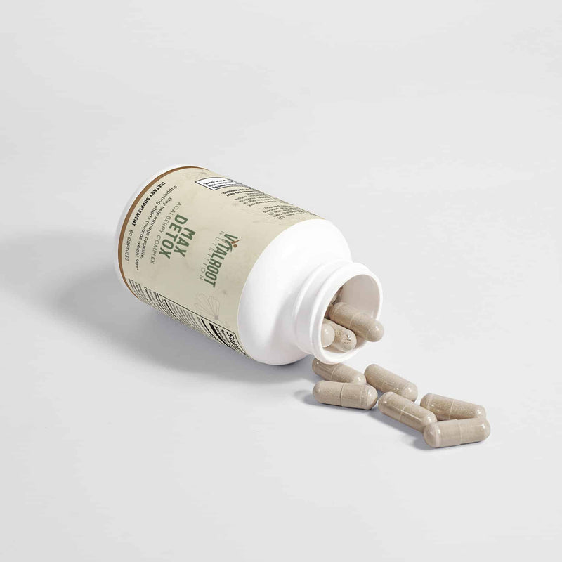 Open Max Detox bottle by Vital Roots with capsules spilled, used for weight and gut health