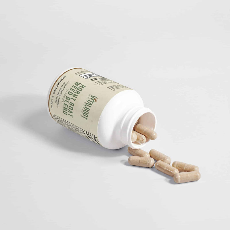 Spilled Horny Goat Weed Blend capsules, showcasing herbal formula for healthy cholesterol levels.
